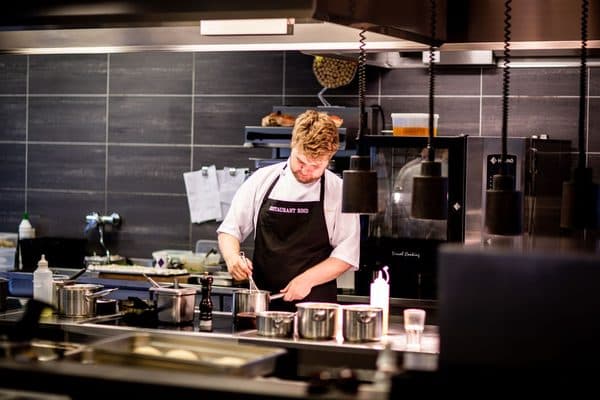 Chef cooking in a professional restaurant kitchen